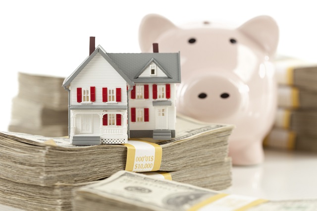 Small House and Piggy Bank with Stacks Money